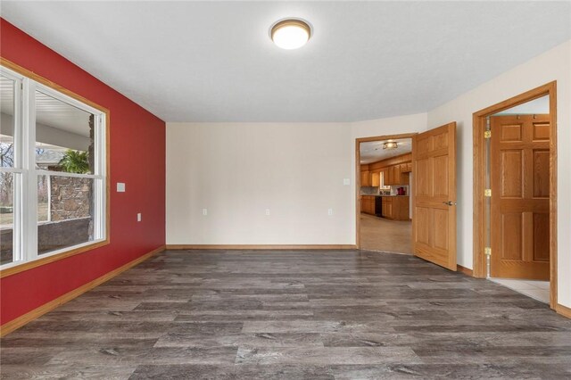 1120 County Road 6012, Berryville, AR 72616 - unfurnished room with baseboards and wood finished floors