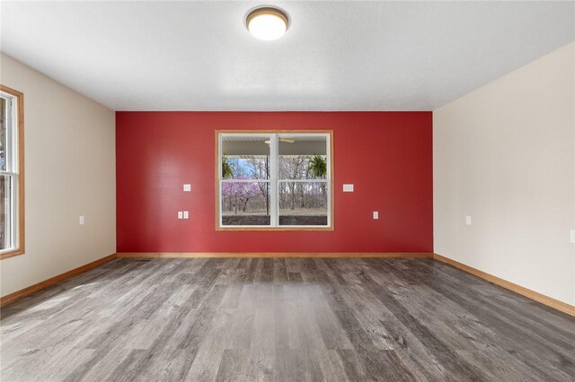 1120 County Road 6012, Berryville, AR 72616 - spare room featuring baseboards and wood finished floors