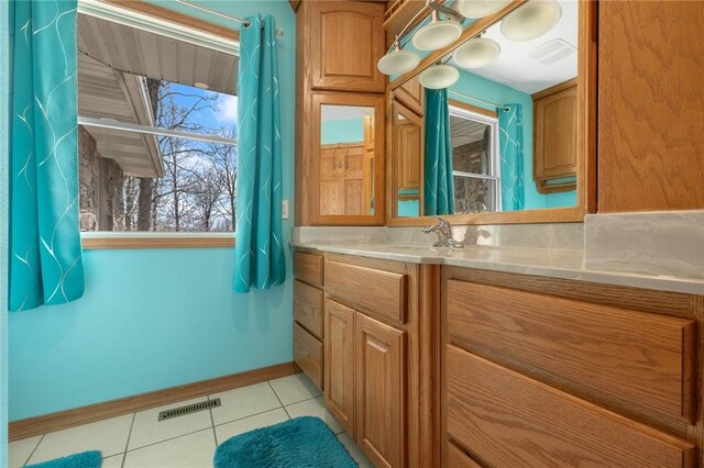 1120 County Road 6012, Berryville, AR 72616 - bathroom with tile patterned floors, visible vents, baseboards, and vanity