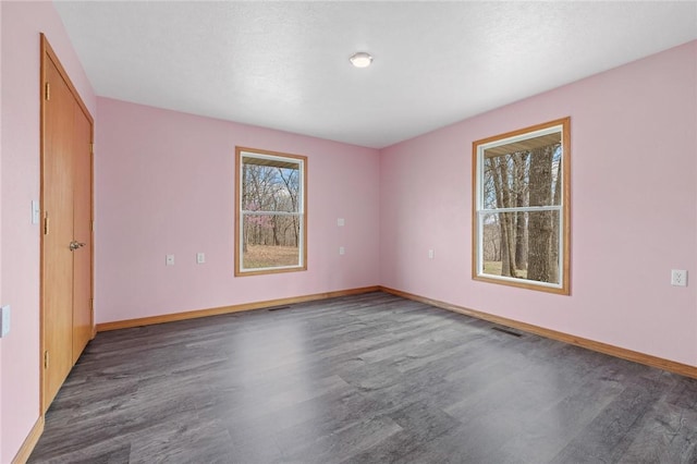 1120 County Road 6012, Berryville, AR 72616 - empty room featuring baseboards, visible vents, and wood finished floors