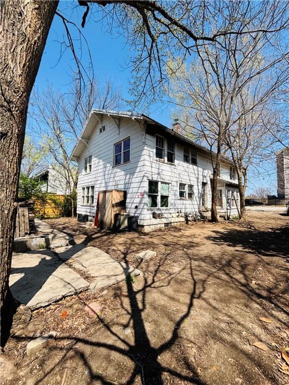 887 S Lt Col Leroy Pond Ave, Fayetteville, AR 72701 - rear view of house featuring a chimney