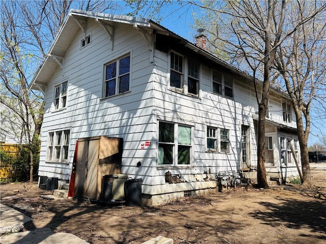 887 S Lt Col Leroy Pond Ave, Fayetteville, AR 72701 - view of home's exterior featuring a chimney and crawl space