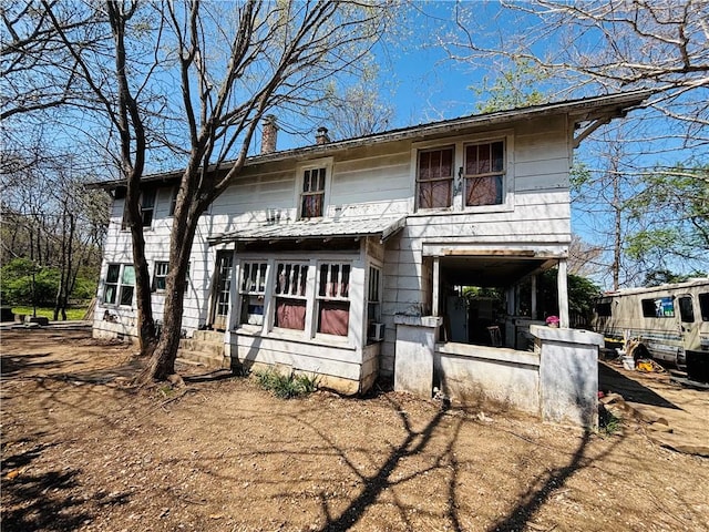 887 S Lt Col Leroy Pond Ave, Fayetteville, AR 72701 - rear view of house featuring a chimney