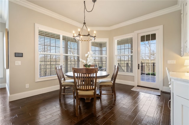 dining room featuring an inviting chandelier, ornamental molding, dark wood finished floors, and baseboards