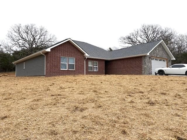 210 Rose Hill Dr, Berryville, AR 72616 - view of front facade with brick siding and a garage