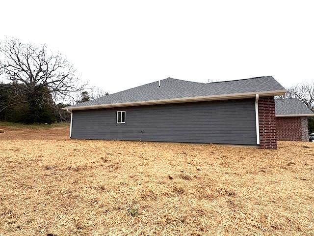 210 Rose Hill Dr, Berryville, AR 72616 - view of home's exterior featuring brick siding