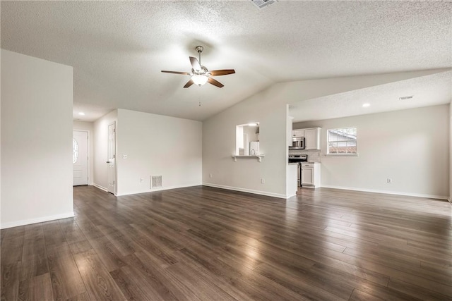 4292 W Beaver Ln, Fayetteville, AR 72704 - unfurnished living room with a ceiling fan, dark wood-style flooring, vaulted ceiling, a textured ceiling, and baseboards