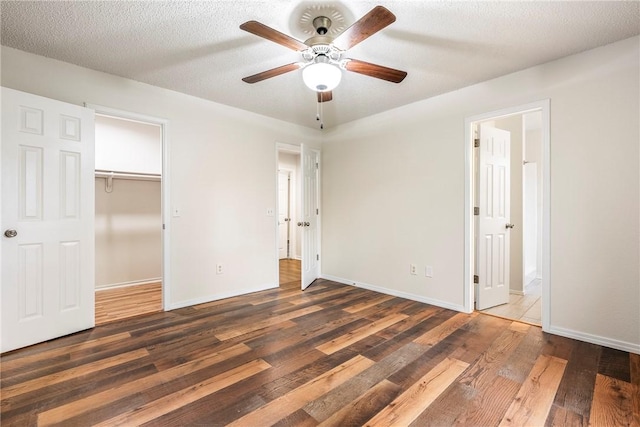 4292 W Beaver Ln, Fayetteville, AR 72704 - unfurnished bedroom featuring wood finished floors, baseboards, a spacious closet, and ensuite bath