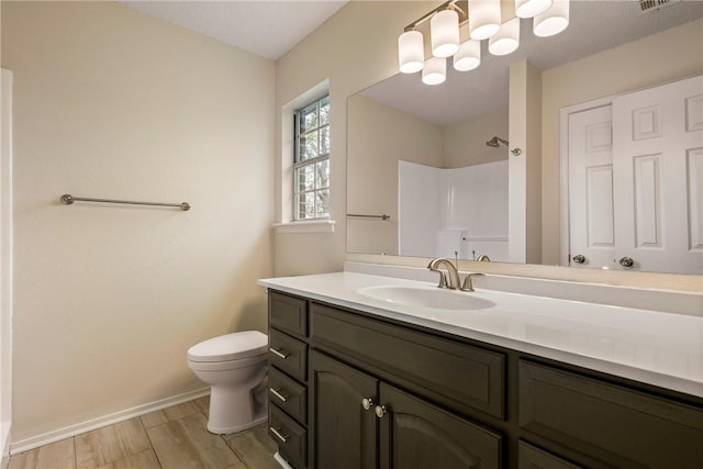 4292 W Beaver Ln, Fayetteville, AR 72704 - bathroom featuring toilet, a shower, baseboards, and vanity