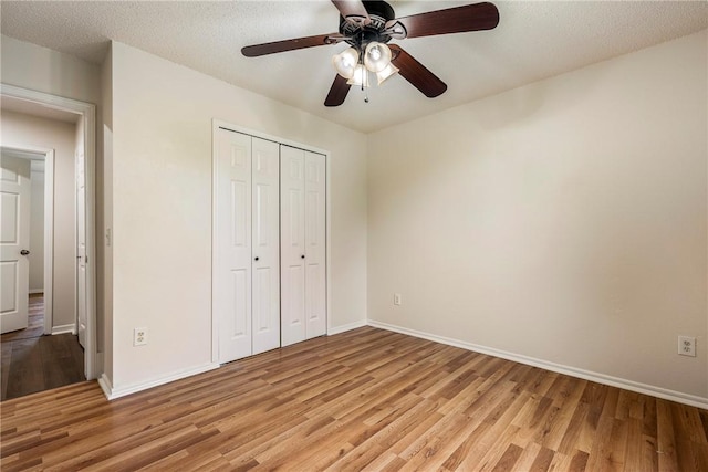 4292 W Beaver Ln, Fayetteville, AR 72704 - unfurnished bedroom with light wood-style flooring, baseboards, a closet, and ceiling fan