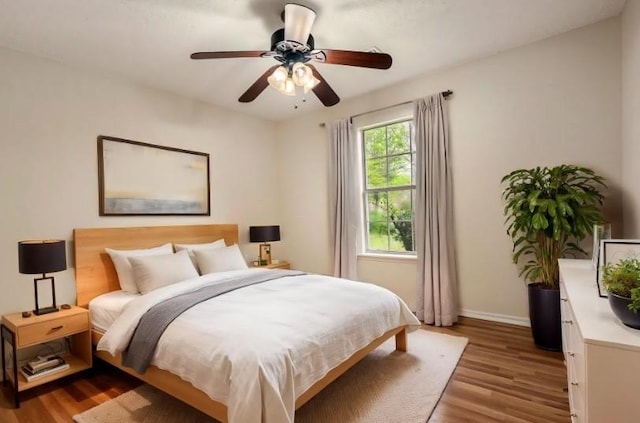 4292 W Beaver Ln, Fayetteville, AR 72704 - bedroom featuring wood finished floors, baseboards, and a ceiling fan