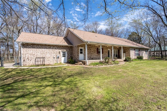 11992 Cripps Rd, Gentry, AR 72734 - exterior space with fence, a gate, a front lawn, covered porch, and brick siding