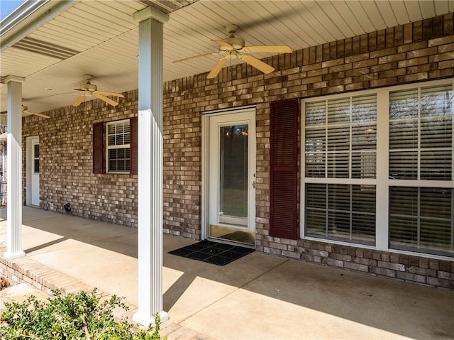 11992 Cripps Rd, Gentry, AR 72734 - entrance to property with brick siding and a ceiling fan