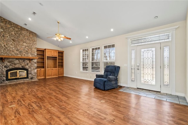 11992 Cripps Rd, Gentry, AR 72734 - entrance foyer with wood finished floors, a stone fireplace, lofted ceiling, ceiling fan, and recessed lighting