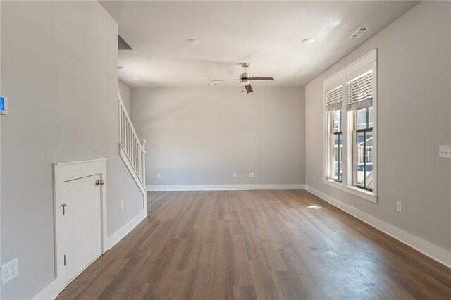 852 S Waxflower Ave, Fayetteville, AR 72701 - spare room featuring a ceiling fan, visible vents, baseboards, and wood finished floors