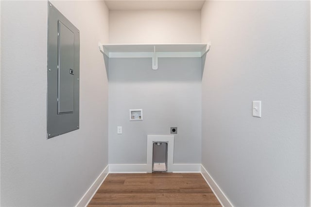 laundry room featuring electric panel, hookup for an electric dryer, washer hookup, laundry area, and wood finished floors