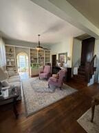 805 N Front St, Dardanelle, AR 72834 - living room featuring built in shelves and wood finished floors