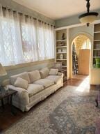 805 N Front St, Dardanelle, AR 72834 - living area with arched walkways and built in features