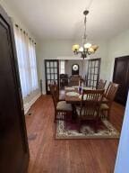 805 N Front St, Dardanelle, AR 72834 - dining area with a chandelier and wood finished floors