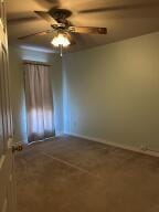 604 S Seattle Ave, Russellville, AR 72801 - carpeted spare room with baseboards and ceiling fan