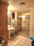 bathroom with a tile shower