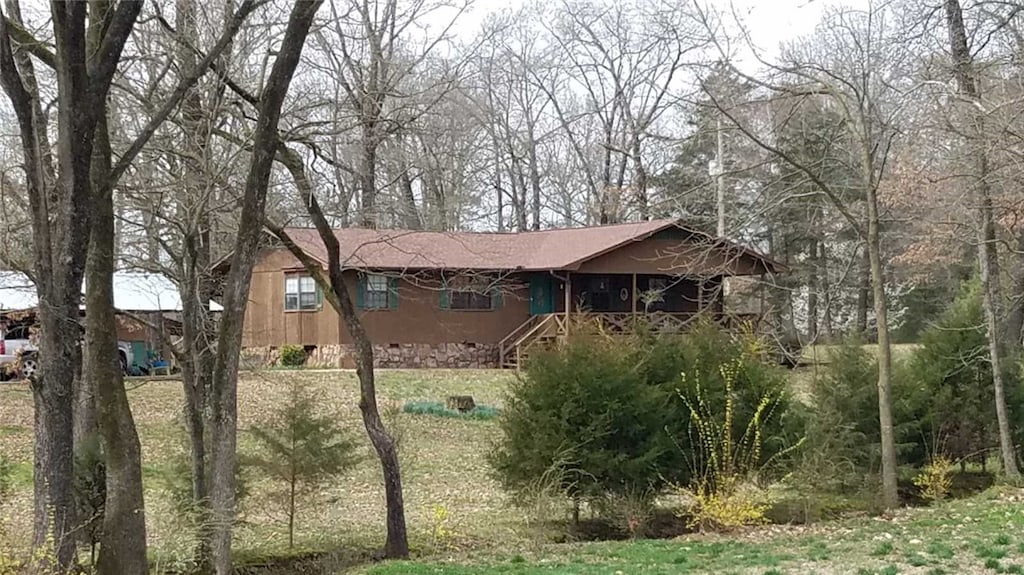 10140 Backwood Ln, Dardanelle, AR 72834 - view of property exterior with stairway and a yard