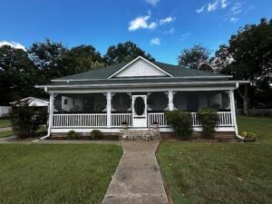 view of front facade with a porch and a front yard