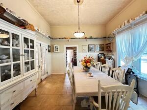 tiled dining space with ornamental molding