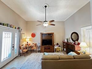 living area with vaulted ceiling and ceiling fan