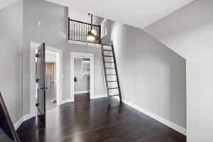 1053 Tucker Mountain Rd, Dover, AR 72837 - interior space featuring wood finished floors, baseboards, and lofted ceiling
