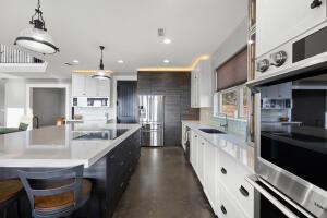 1053 Tucker Mountain Rd, Dover, AR 72837 - kitchen featuring light countertops, a sink, black electric cooktop, and stainless steel oven