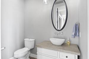1053 Tucker Mountain Rd, Dover, AR 72837 - half bath with vanity, baseboards, and toilet