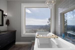 1053 Tucker Mountain Rd, Dover, AR 72837 - bathroom with baseboards, a notable chandelier, and vanity