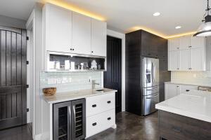 1053 Tucker Mountain Rd, Dover, AR 72837 - kitchen with a sink, light countertops, white cabinetry, and beverage cooler