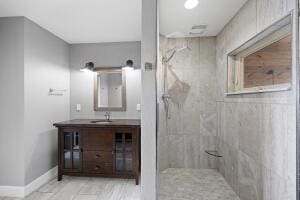 1053 Tucker Mountain Rd, Dover, AR 72837 - bathroom with a tile shower, vanity, and baseboards