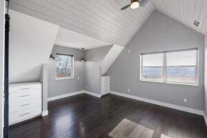 1053 Tucker Mountain Rd, Dover, AR 72837 - bonus room featuring lofted ceiling, baseboards, a ceiling fan, and wood finished floors
