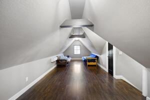 1053 Tucker Mountain Rd, Dover, AR 72837 - bonus room featuring wood finished floors, baseboards, and lofted ceiling