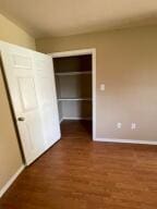 11307 Lakeridge Rd, Dardanelle, AR 72834 - unfurnished bedroom featuring baseboards and wood finished floors