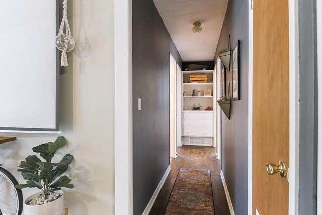 hallway featuring baseboards