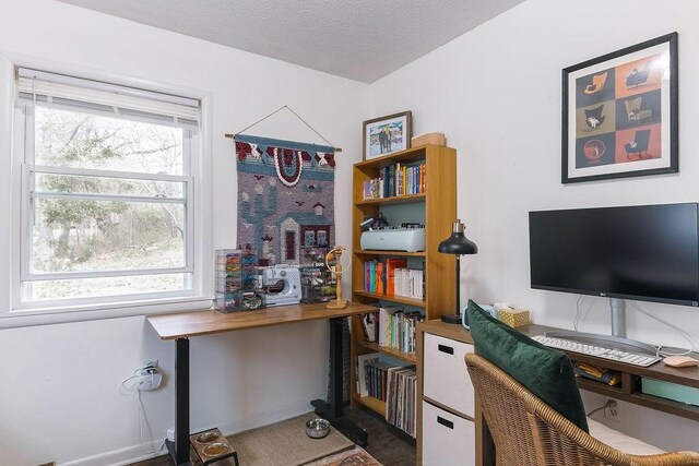home office featuring a textured ceiling