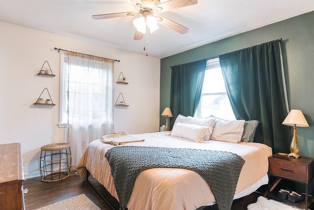 bedroom featuring wood finished floors and a ceiling fan