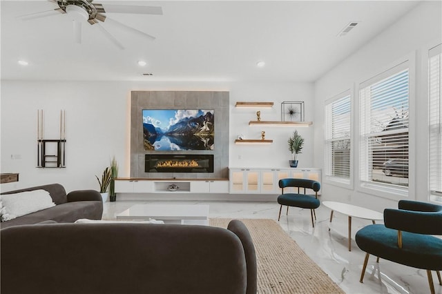 1151 NE Monroe St, Bentonville, AR 72712 - living room with light marble finish floors, recessed lighting, ceiling fan, and a large fireplace
