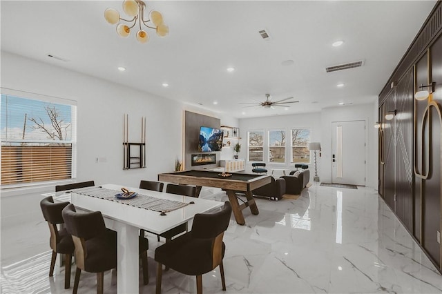 1151 NE Monroe St, Bentonville, AR 72712 - dining area featuring recessed lighting, a chandelier, light marble finish flooring, and a ceiling fan