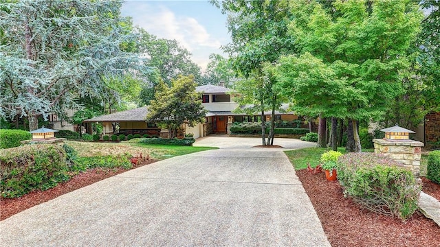 view of front of property with a garage and concrete driveway
