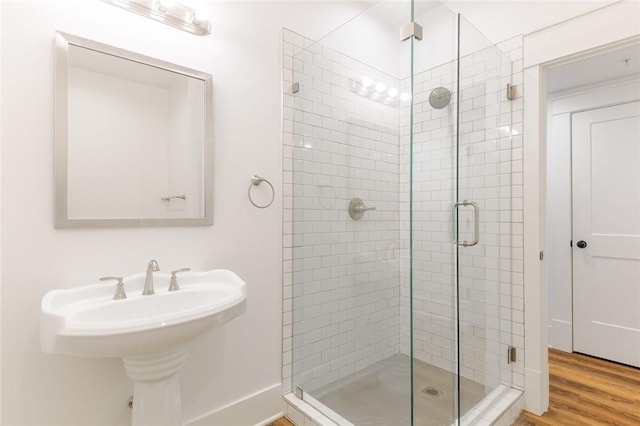 144 N Washington Ave Unit 102, Fayetteville, AR 72701 - full bathroom with a shower stall and wood finished floors