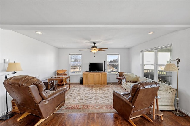 living room featuring a ceiling fan, recessed lighting, baseboards, and wood finished floors