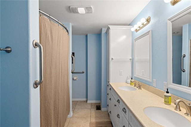 full bath with tile patterned flooring, a sink, double vanity, and visible vents