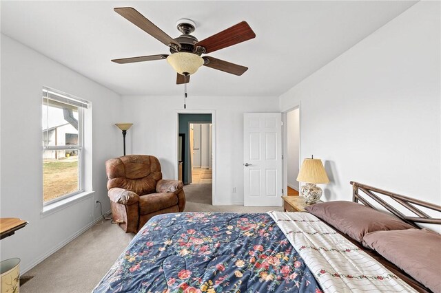 bedroom featuring baseboards, carpet flooring, and a ceiling fan