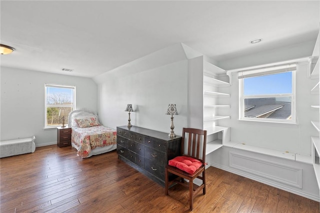 bedroom with visible vents and wood-type flooring
