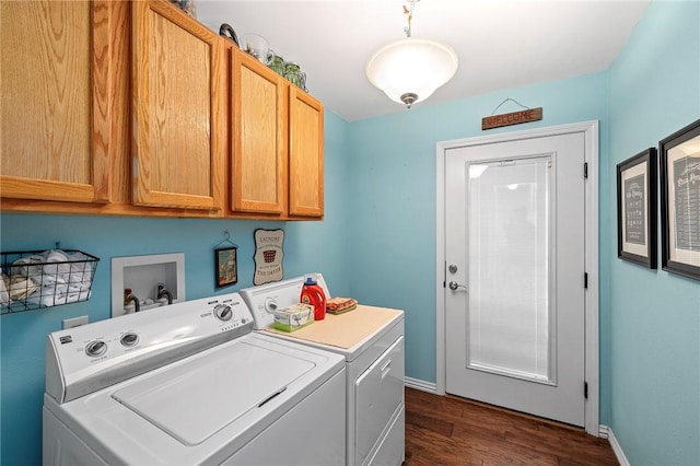 washroom with washer and clothes dryer, cabinet space, baseboards, and dark wood-style flooring